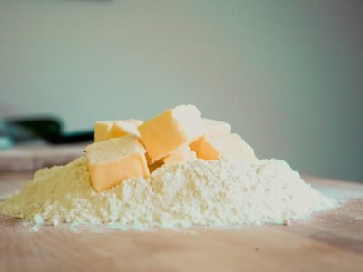 Close-up of butter and flour on a kitchen counter, perfect for baking.